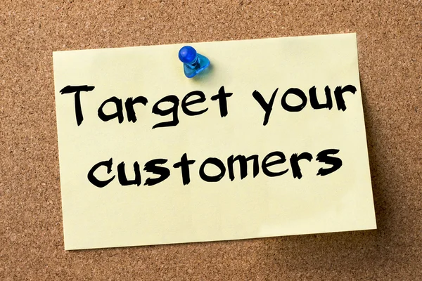 Target your customers - adhesive label pinned on bulletin board