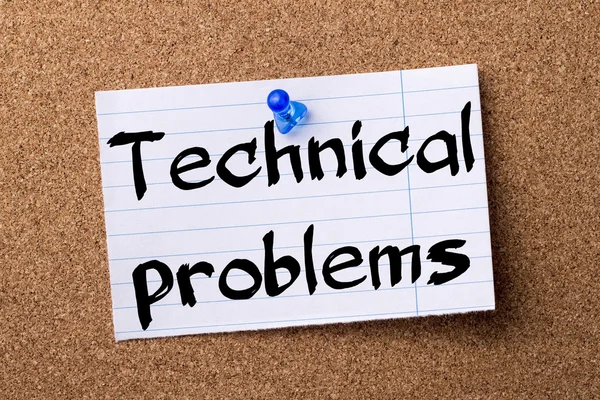 Technical problems - teared note paper pinned on bulletin board — Stock Photo, Image