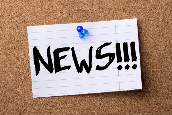 NEWS!!! - teared note paper pinned on bulletin board — Stock Photo, Image