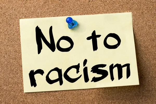 No to racism - adhesive label pinned on bulletin board