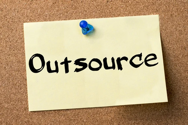 Outsource - adhesive label pinned on bulletin board — Stock Photo, Image