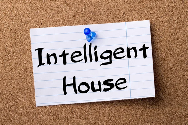 Intelligent House - teared note paper pinned on bulletin board