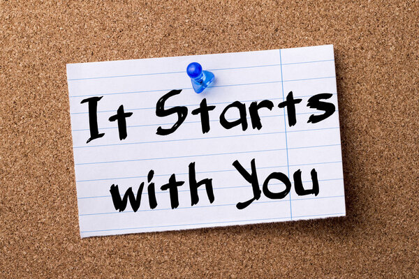 It Starts with You - teared note paper pinned on bulletin board