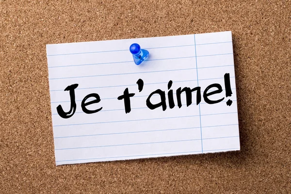 Je t'aime! - teared note paper pinned on bulletin board — Stock Photo, Image