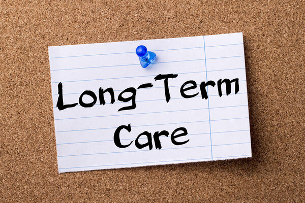 Long-Term Care - teared note paper pinned on bulletin board