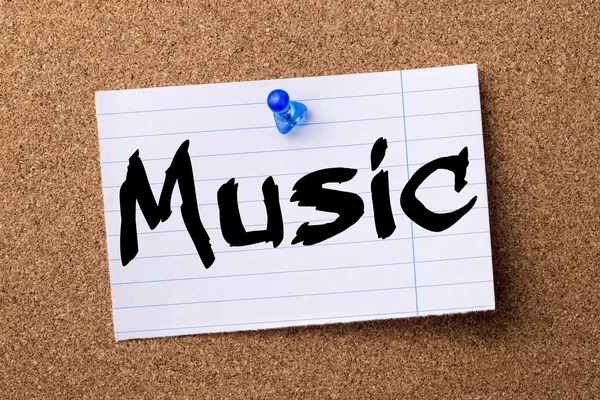 Music - teared note paper pinned on bulletin board — Stock Photo, Image