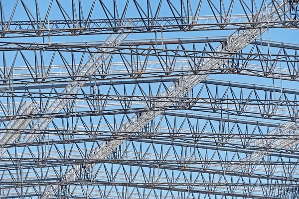 steel structure workshop is under construction on a background blue sky