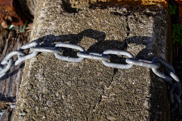 Silver Chain Its Shadow Concrete Pile — Stock Photo, Image