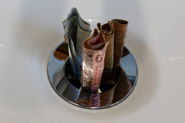 Throwing money down the drain, wasteful