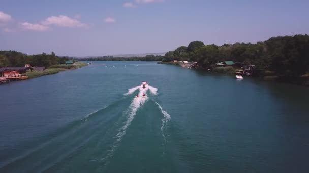 Jet Boat Pulling Two People Sitting Donuts — Stock Video