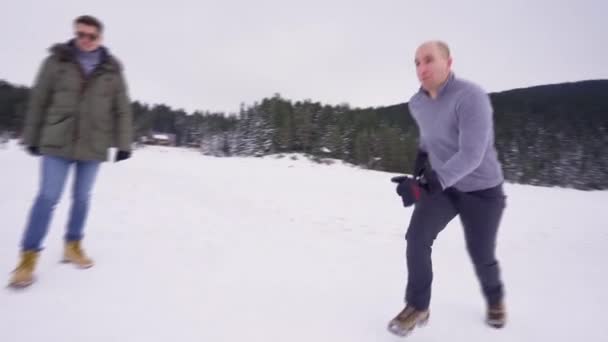 Mountain Hiker Running Sliding Frozen Lake His Friends — Stock Video