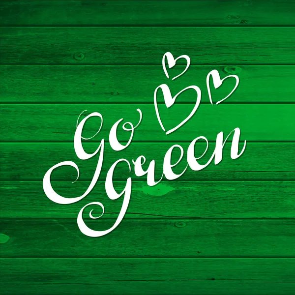 Ecología mensaje caligráfico Go Green. Tablones de madera . — Vector de stock