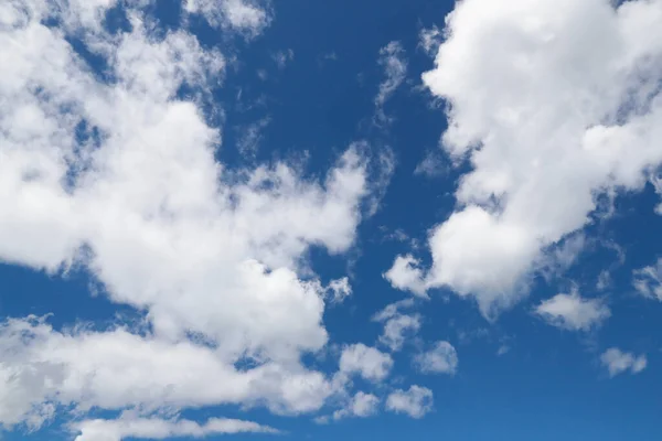 White clouds and blue sky.  France.