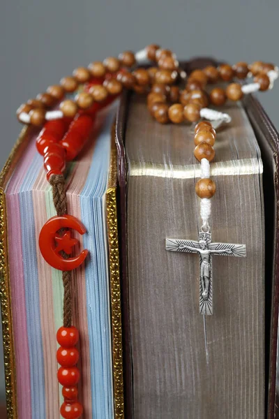 Religious symbols. Quran, bible and prayer beads. Christianity, Islam. Interfaith dialogue.