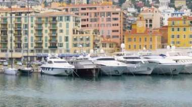 A boat is docked in front of a building