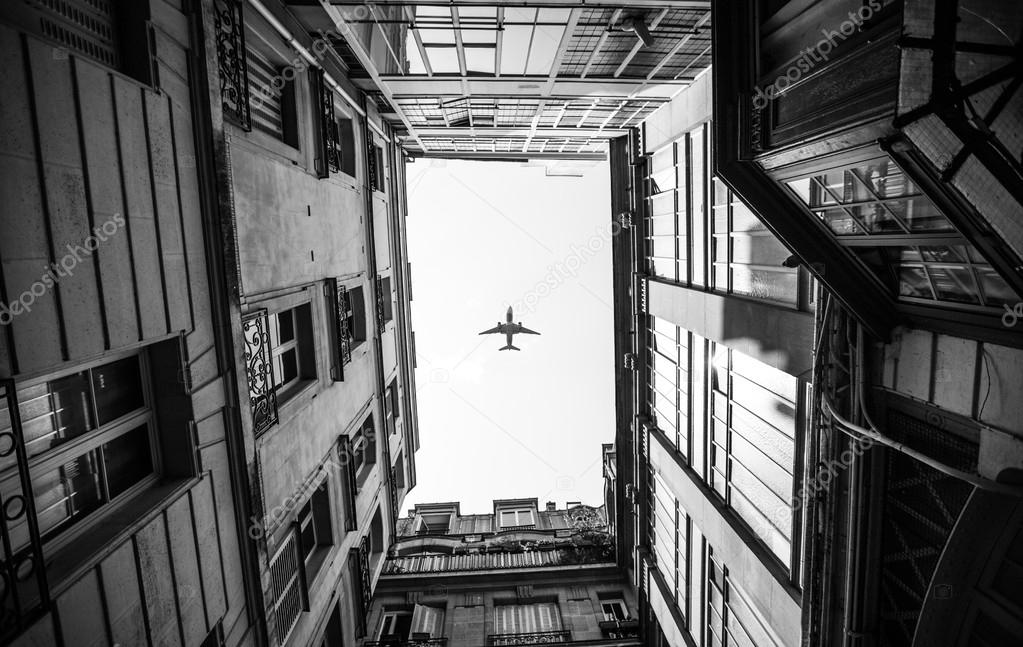 aircraft fly pass Paris France in black and white