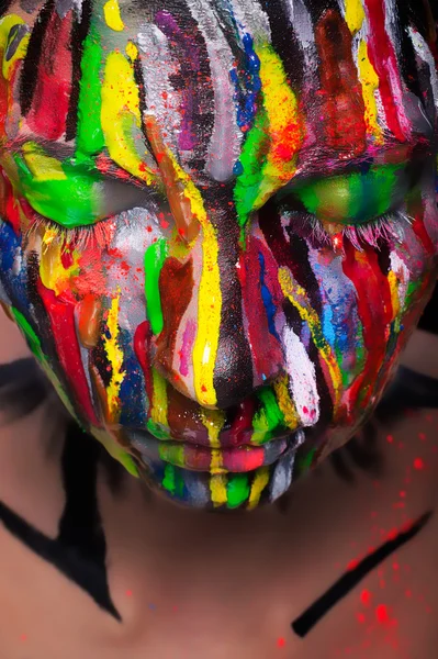 Girl with colored face painted. Art beauty image. — Stock Photo, Image