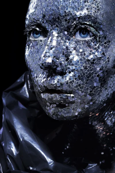 Beautiful face of a woman covered in big glitter Closeup woman, silver pieses on body — Stock Photo, Image