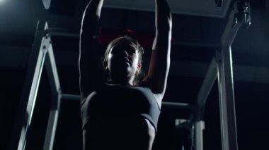 Athletic Beautiful Woman Does Overhead Lift with a Barbell in the Gym.