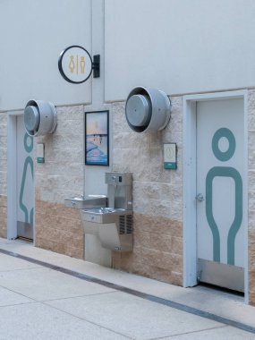 Public Restrooms at an outdoor shopping center. clipart