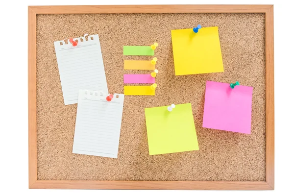 Isolated wooden board with colorful sticky notes and paper