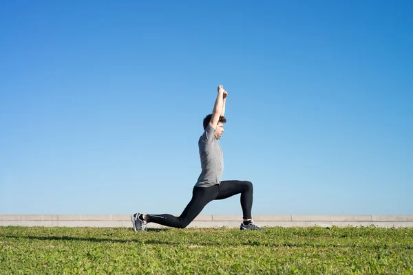 Man doing stretching after running space for text — Stock Photo, Image