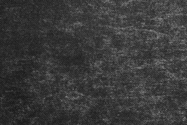 Koyu renk. Denim kot desenli yırtık. Dikilmiş desenli kot pantolon arka planı.