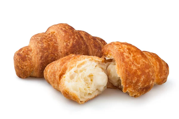 Croissants sobre fondo blanco, croissants rellenos de vainilla sobre fondo blanco — Foto de Stock