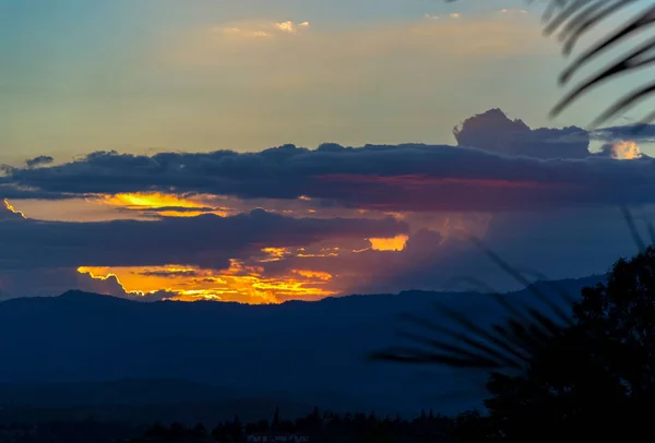 Multiple esposure of the very last stage of a sunset over the Andean mountains of central Colombia.