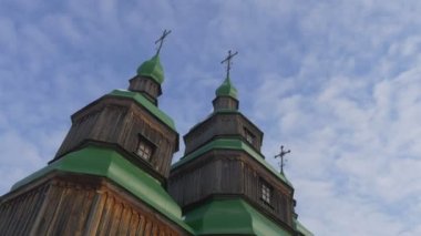 Wooden Church Green Roofs on a Bell Towers Winter Blue Sky Church of Paraskeva the Holy Martyr in Pirogovo Ukrainian Sacral Architecture Baroque Style