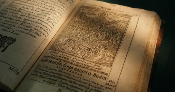 Old Book Paterik Of Kiev-Pecherska Lavra Old-Slavic Style of Writing Engravings Pictures Episodes from the Life of Saints Monks Turning Pages of Book — Stock Video