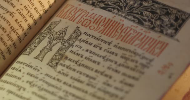 Old Book Paterik of Kiev-Pecherska Lavra Old-Slavic Style of Writing Engravings Pictures Episodes from the Life of Saints Monks Turning Pages of Book — Stock Video