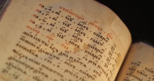 Old Book Paterik of Kiev-Pecherska Lavra Old-Slavic Style of Writing Engravings Pictures Episodes from the Life of Saints Monks Turning Pages of Book — Stock Video