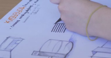 Woman's Hand Close Up With Pen Students Of Faculty Of Architecture Classroom Architectural Sketches Drawings Designs Schematic Drawn On Paper Indoors