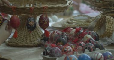 Woman Hangs Painted Easter Eggs On Wicker Stand Still Life Of Easter Eggs Girls Draw On Easter Eggs Technology Of Painting On Easter Egg
