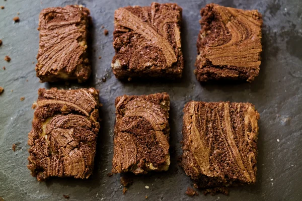 Marble cake brownies on stone slate dark background — Stock Photo, Image