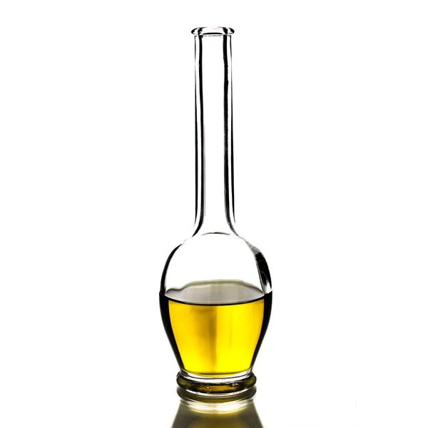 Cretan extra virgin olive oil in a glass bottle for salad dressings on a pure white background