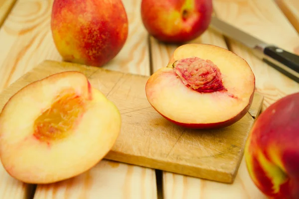 Fresh, vegeterian, juiciy, red and yellow nectarines whole and c