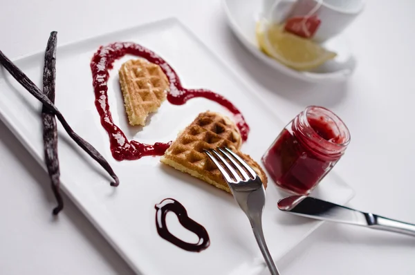 Heart waffle, marmalade, chocolate sauce, vanilla sticks, square — Stock Fotó