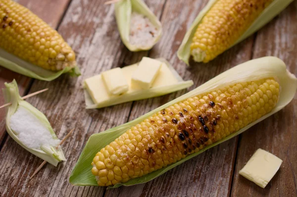 Grilled corn in husk with butter, salt