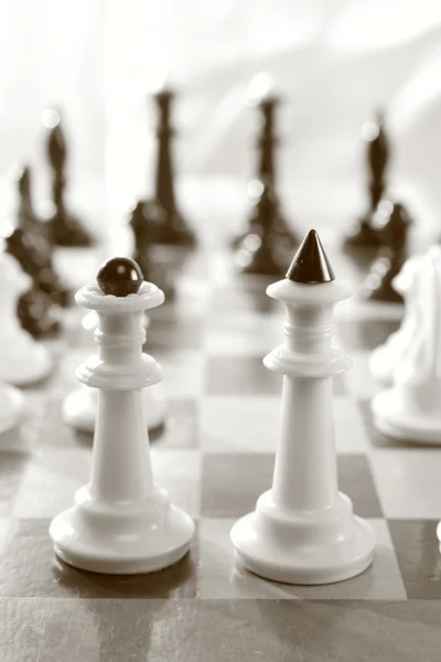 Chess pieces on the game board, sepia — Stock Photo, Image