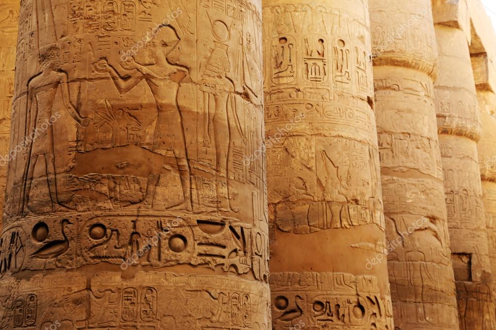 Pillars of the Karnak temple with ancient egypt symbols, Luxor, Egypt