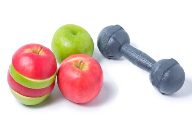 Kırmızı ve yeşil elma dumbbell ile dilim