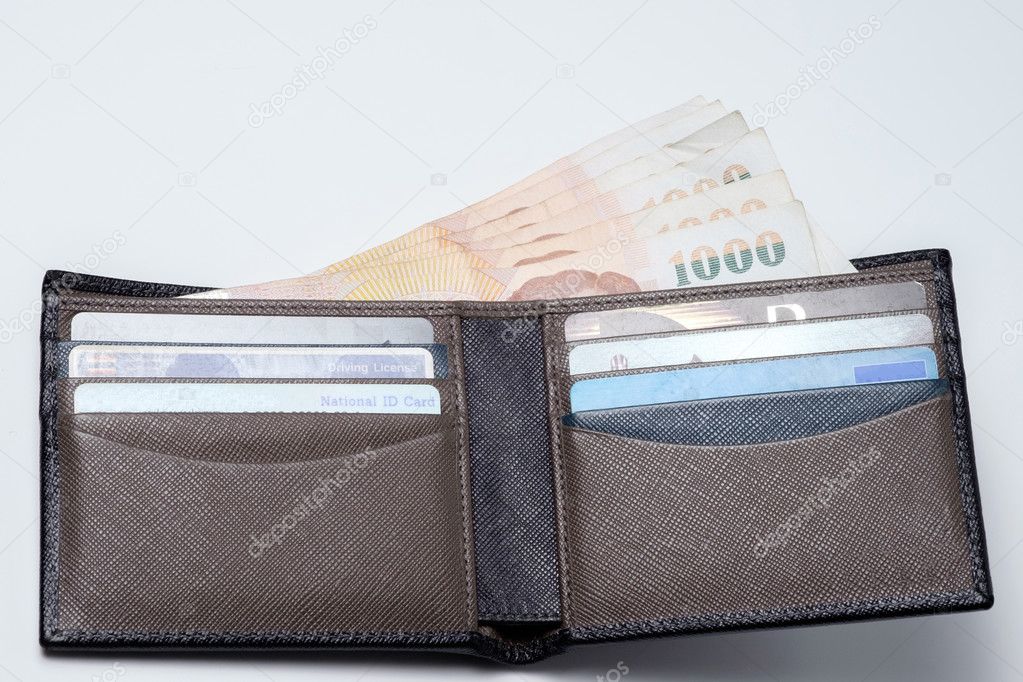 thai money and credit card in lather wallet .