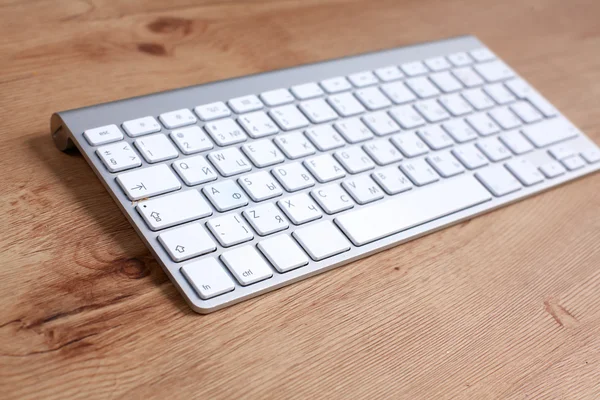 Modern aluminum computer keyboard on the table — Stock Photo, Image