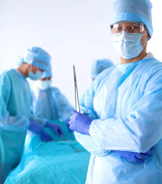 Team of surgeon in uniform perform operation on a patient at cardiac surgery clinic — Stock Photo, Image