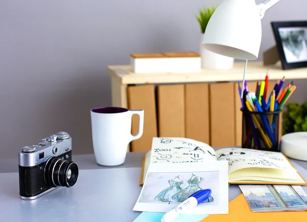 Designer table with him lying on the instruments and camera — Stock Photo, Image