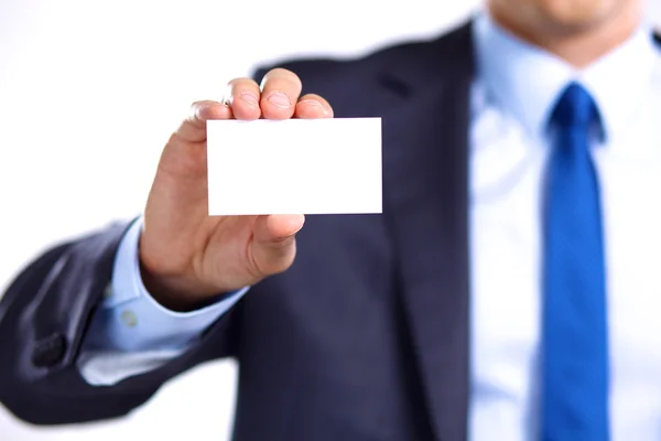 Mans hand showing business card - close seup shot on grey background — стоковое фото