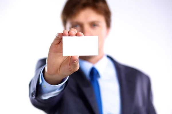 Mano de hombre mostrando tarjeta de visita - primer plano sobre fondo gris — Foto de Stock