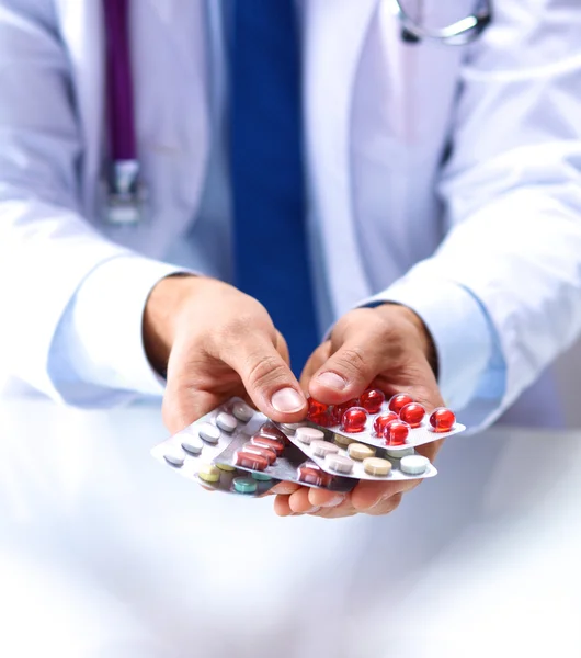 Packing pills male doctor stretches in hand — Stock Photo, Image